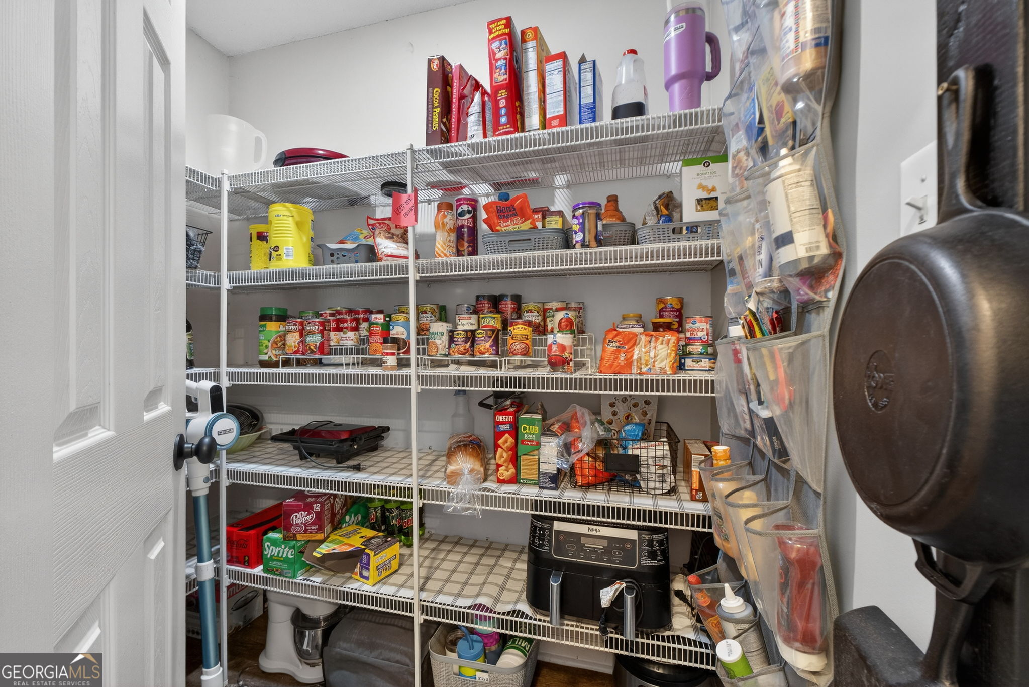 417 Stuarts Lane Locust Grove, GA 30248 - Photo 6 of 48 a store room with lots of clutter and storage