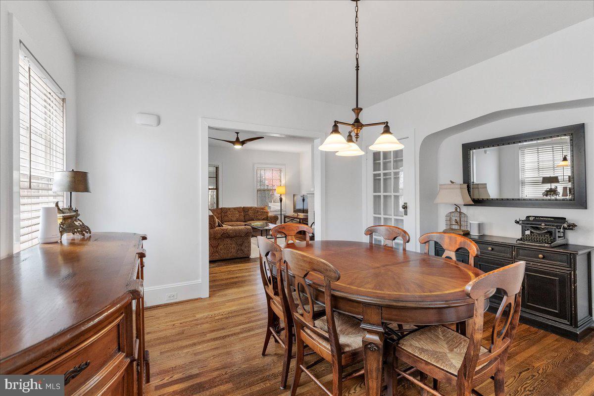 29 Jefferson Road Princeton, NJ 08540 - Photo 11 of 24 a dining room with furniture a chandelier and wooden floor