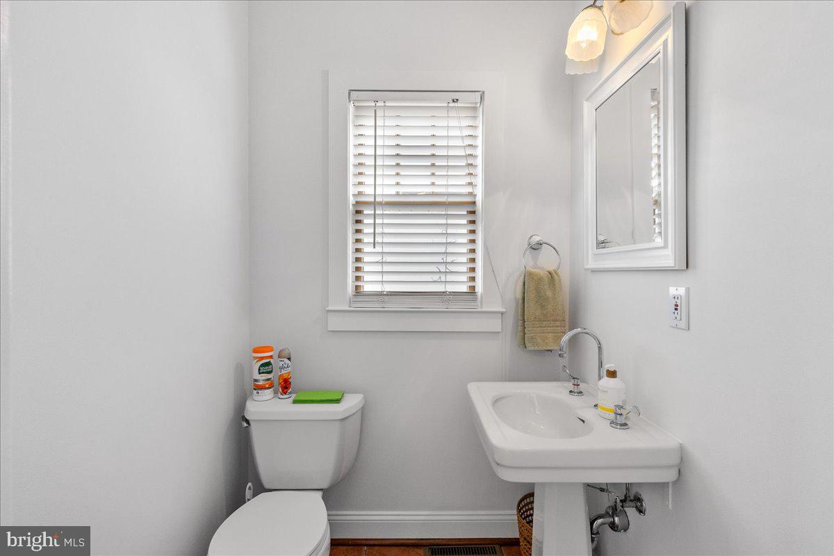 29 Jefferson Road Princeton, NJ 08540 - Photo 14 of 24 a bathroom with a sink mirror and toilet