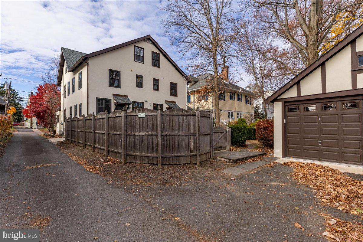 29 Jefferson Road Princeton, NJ 08540 - Photo 24 of 24 a white house that has a small yard and a large parking space