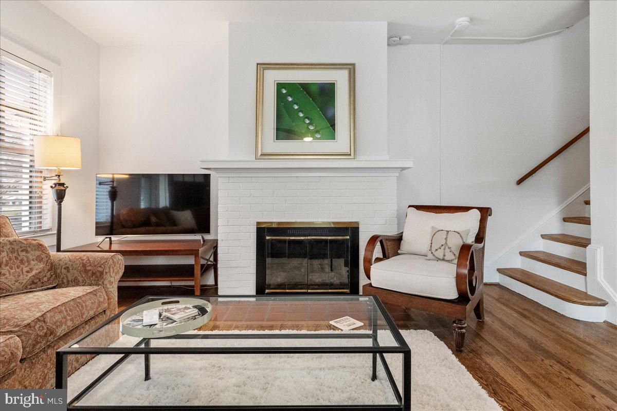 29 Jefferson Road Princeton, NJ 08540 - Photo 9 of 24 a living room with furniture a flat screen tv and a fireplace
