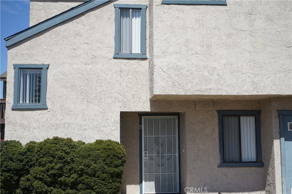 a front view of a house with brick walls