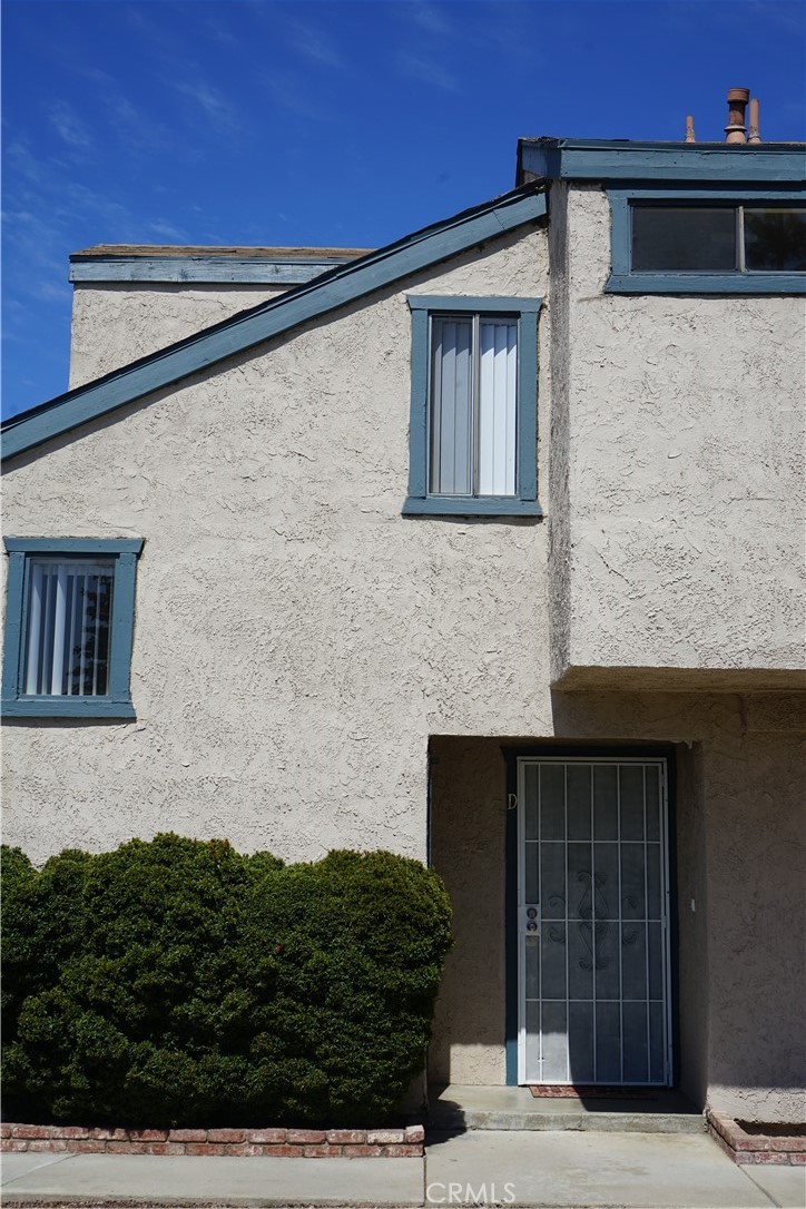 9090 Colony Place, Unit D Riverside, CA 92503 - Photo 2 of 24 a front view of a house with plants