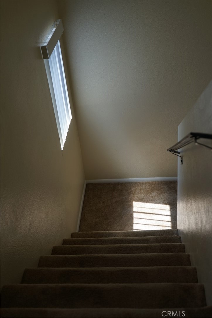 9090 Colony Place, Unit D Riverside, CA 92503 - Photo 24 of 24 a view of entryway and hall with wooden floor