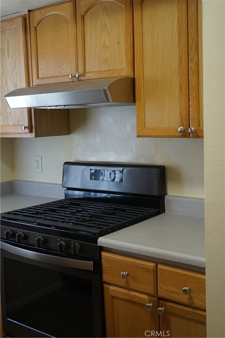 9090 Colony Place, Unit D Riverside, CA 92503 - Photo 5 of 24 a close view of a stove a sink and dishwasher