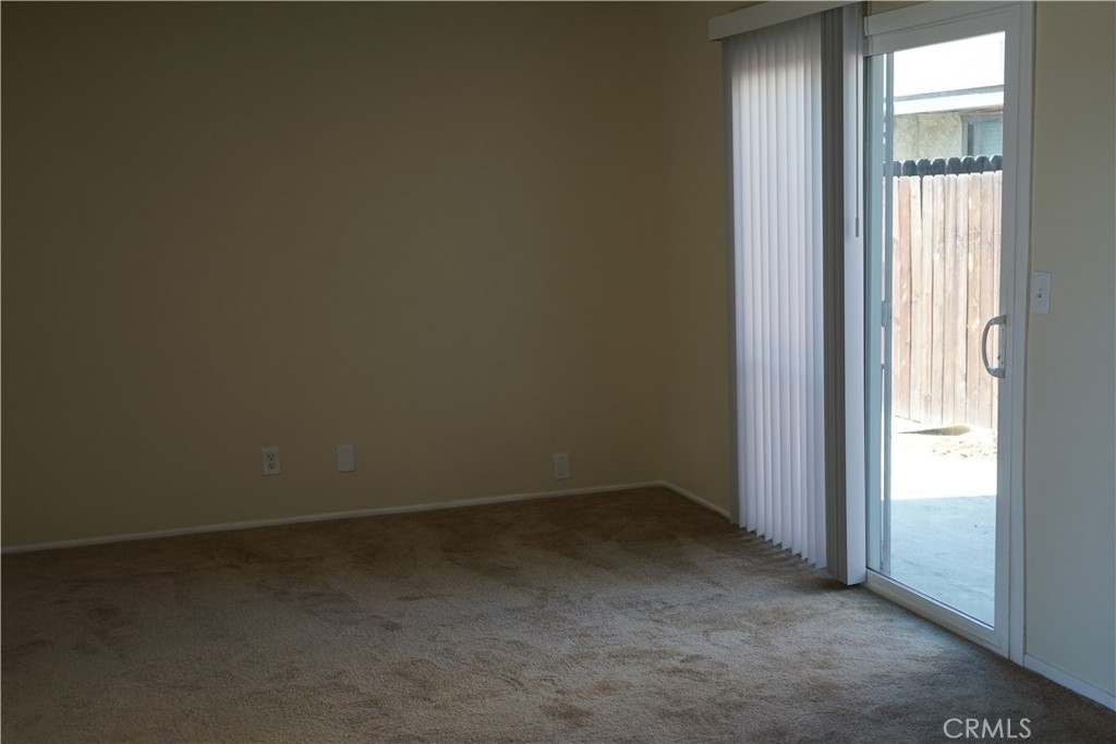9090 Colony Place, Unit D Riverside, CA 92503 - Photo 10 of 24 wooden floor and window in an empty room
