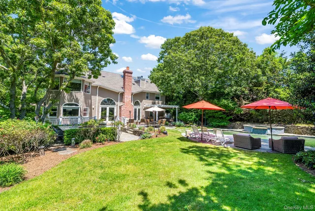 a front view of house with yard and outdoor seating