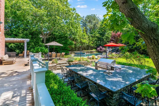 a backyard of a house with outdoor seating