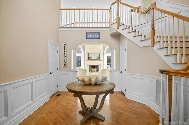 a view of hall way with furniture