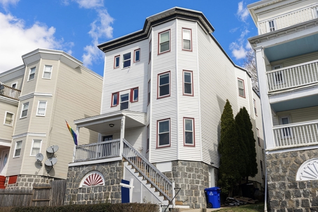 101 Draper Street, Unit 2 Boston, MA 02122 - Photo 19 of 19 a front view of a house with a garage