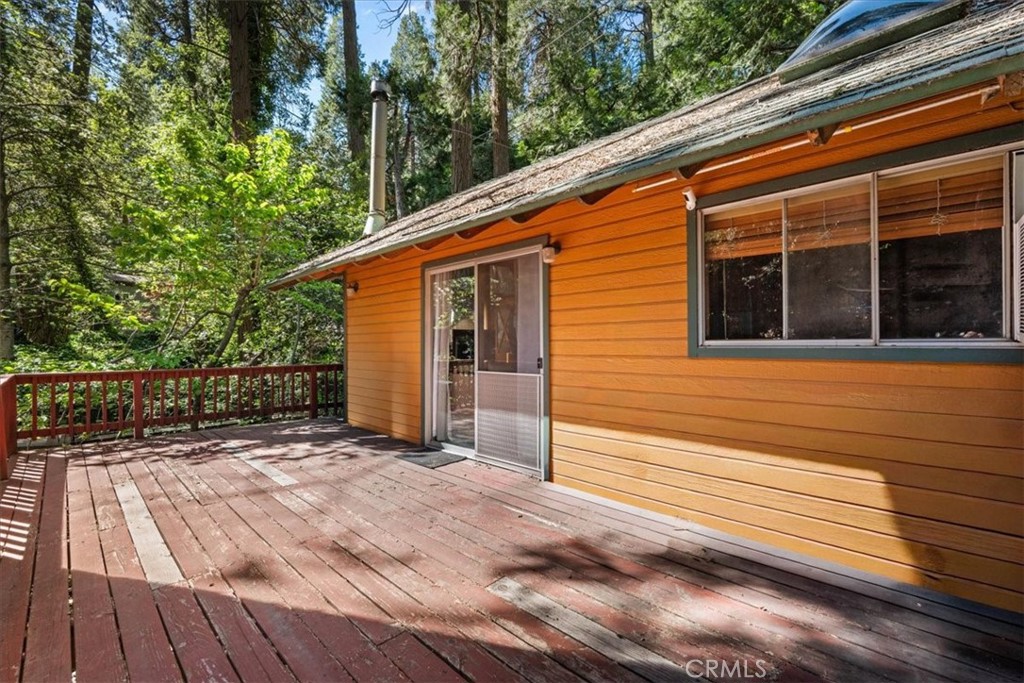 697 Mormon Springs Road Crestline, CA 92325 - Photo 11 of 37 a view of house with backyard and wooden floor
