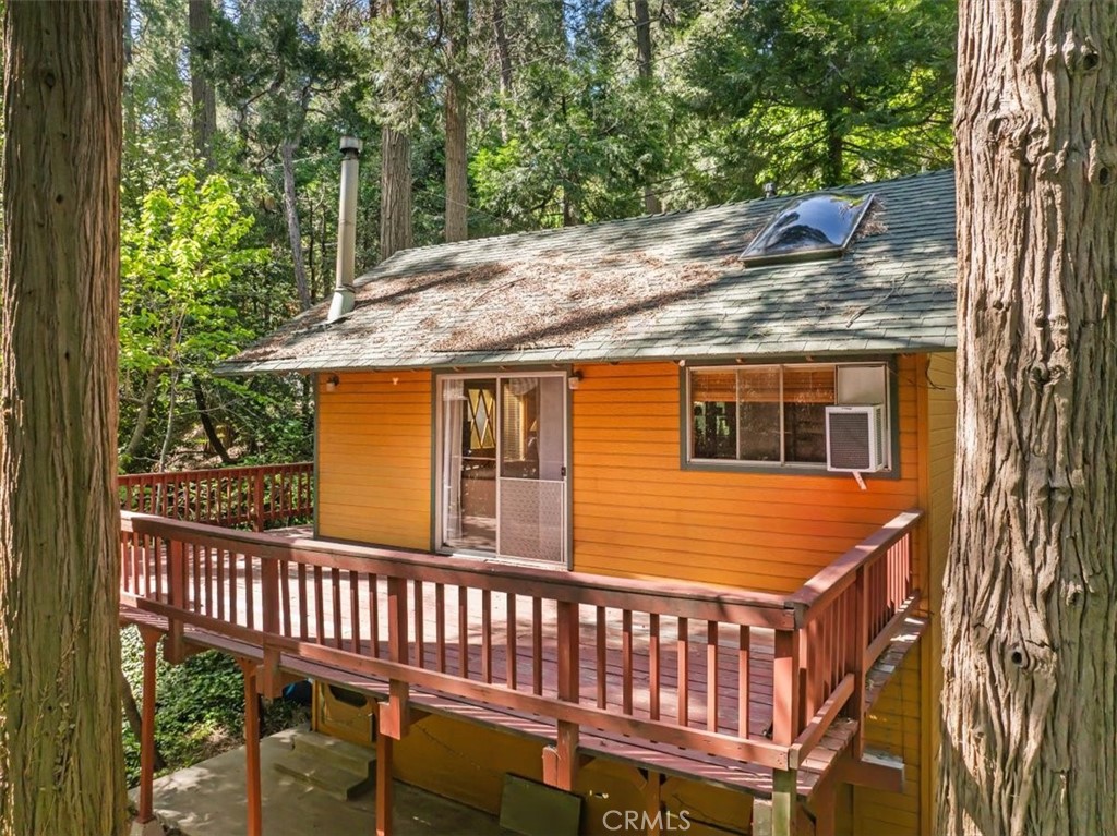 697 Mormon Springs Road Crestline, CA 92325 - Photo 28 of 37 a view of a wooden deck and a backyard