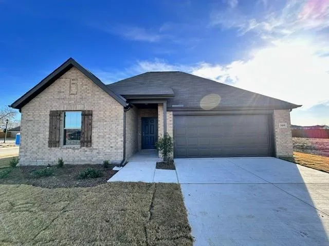 a front view of a house with yard