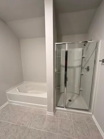 a bathroom with a bath tub