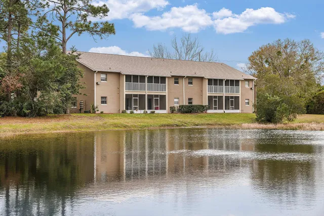 a view of pool with brick walls