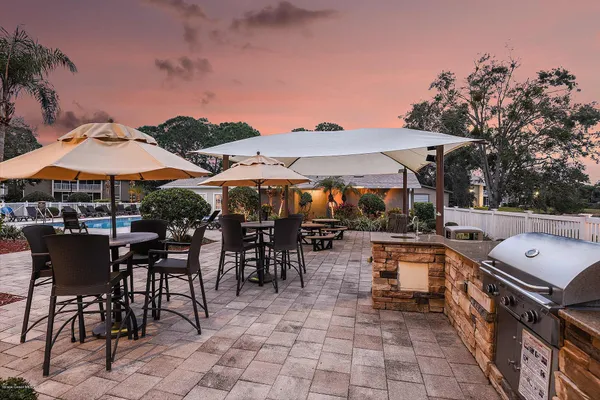 a view of a patio with chairs and tables