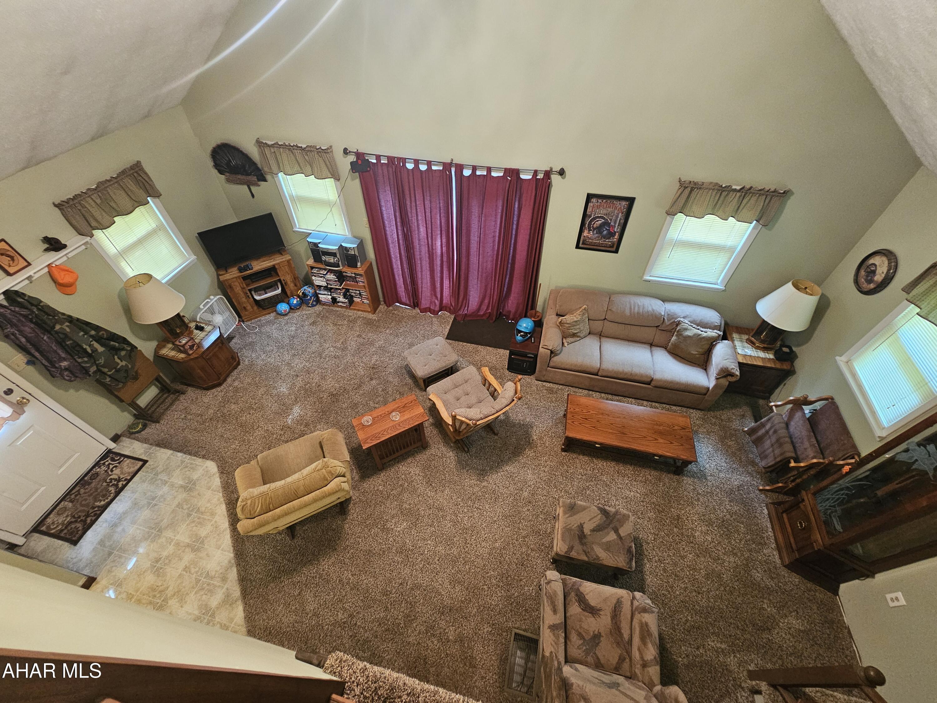 207 Kendrick Lane Flinton, PA 16640 - Photo 21 of 30 a living room with furniture and a flat screen tv