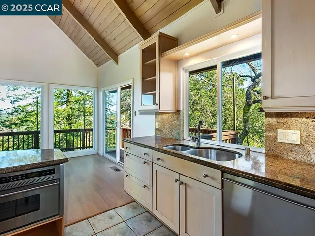 a kitchen that has a sink and cabinets