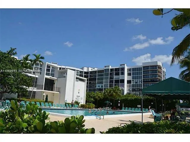 a view of swimming pool with outdoor seating and plants
