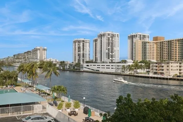 a view of lake with yard