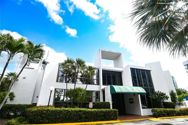 a room with pool table and chairs