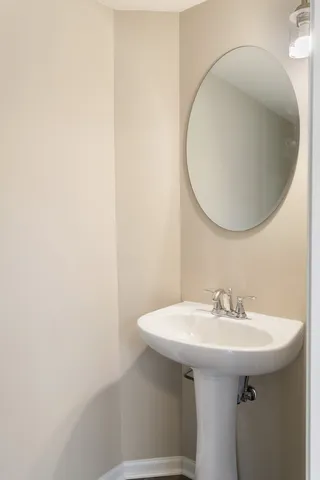 a bathroom with a bathtub and a sink