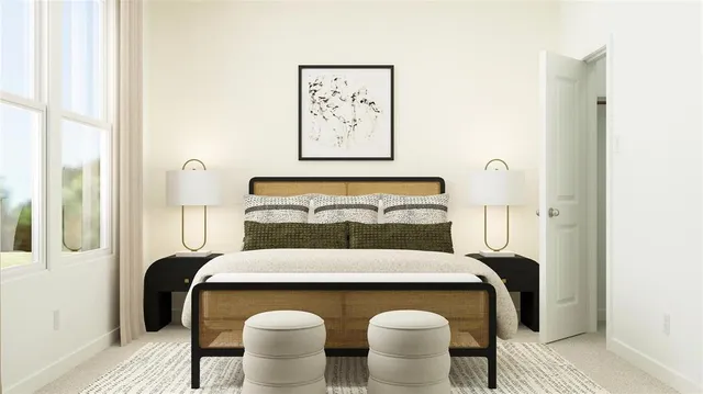 a bedroom with a bed and glass windows