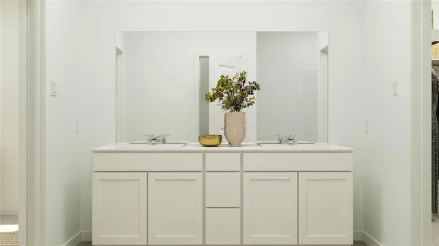 a bathroom with a sink and vanity
