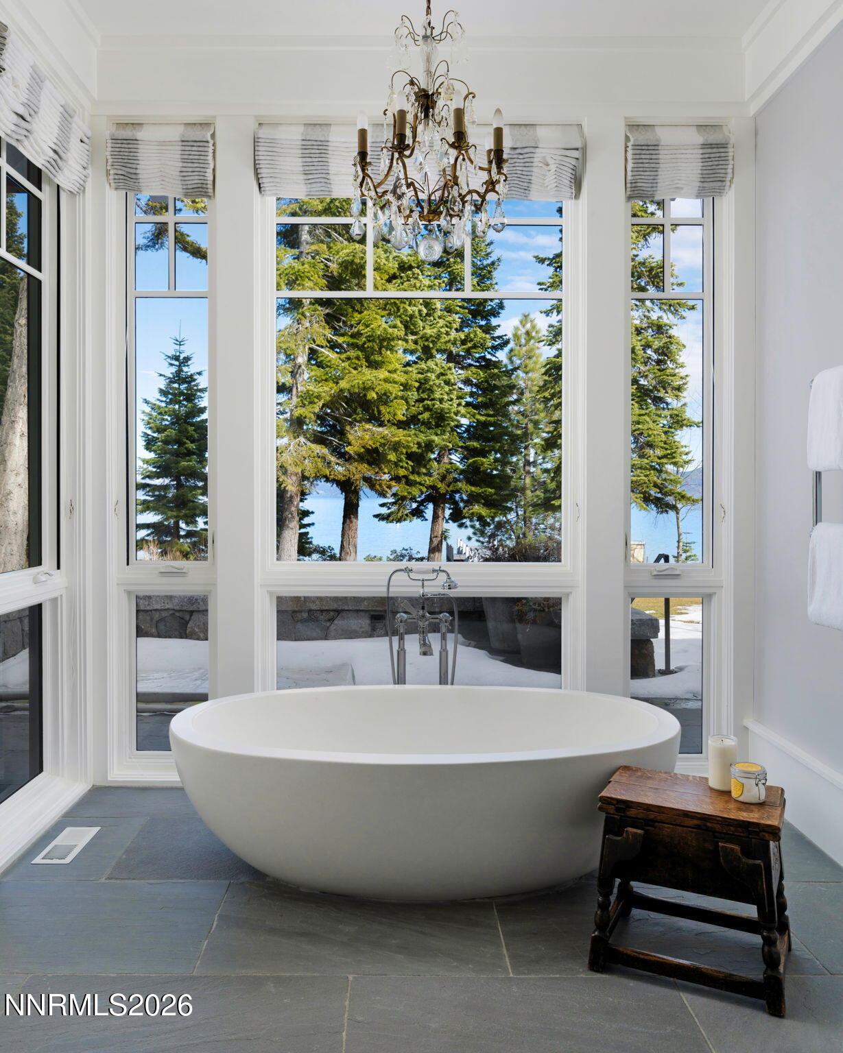 226 4 Ring Road Tahoma, CA 96142 - Photo 21 of 41 a spacious bathroom with a bathtub and chandelier
