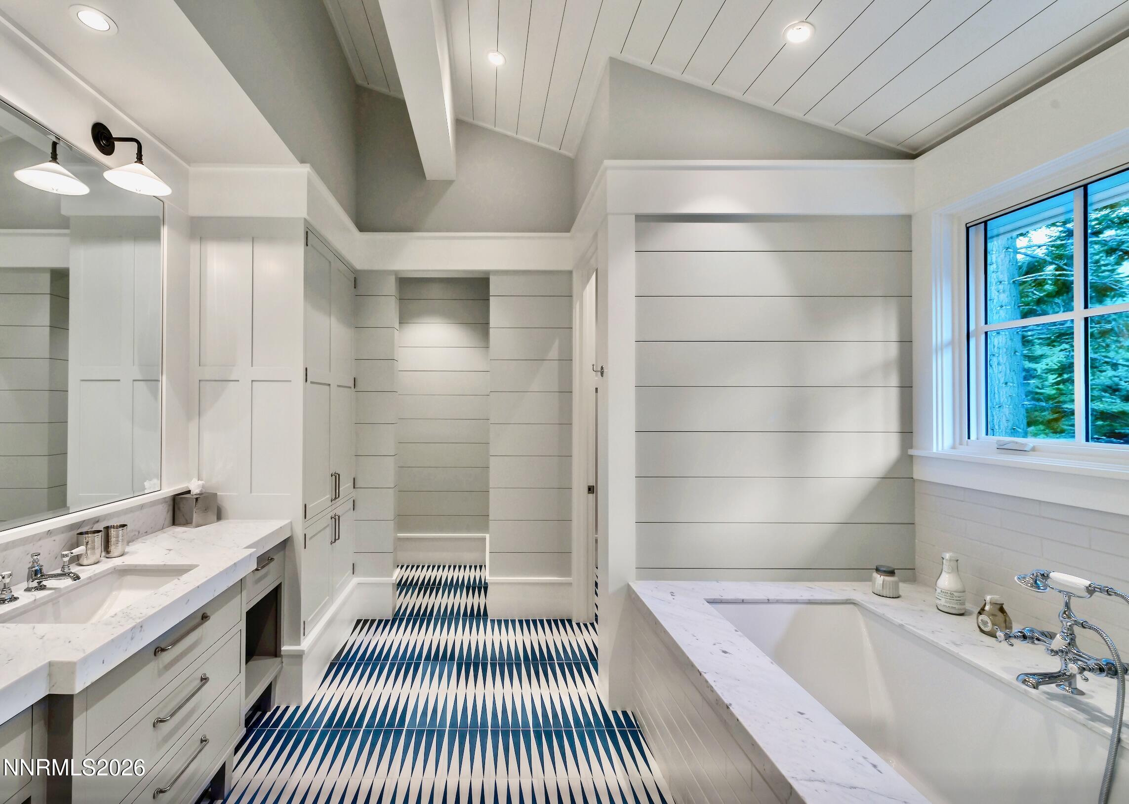 226 4 Ring Road Tahoma, CA 96142 - Photo 32 of 41 a bathroom with a sink a large mirror and a bathtub