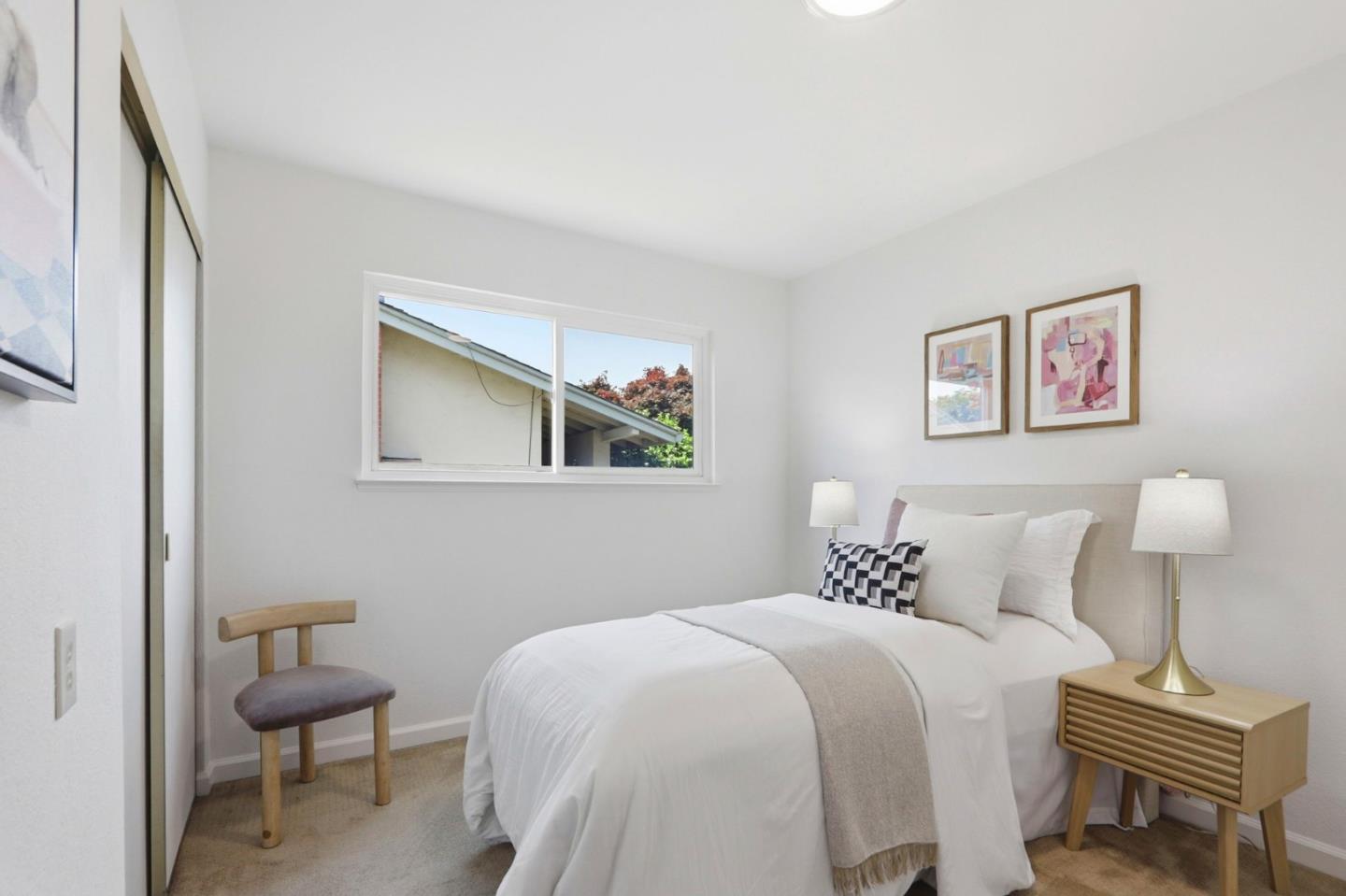 546 Woodstock Way Santa Clara, CA 95054 - Photo 12 of 24 a bedroom with a bed and a lamp on table