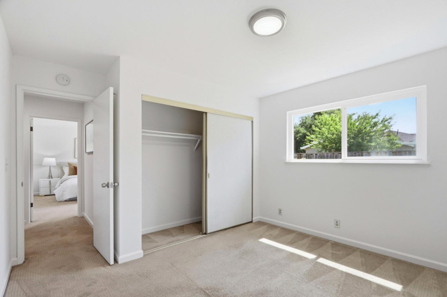 546 Woodstock Way Santa Clara, CA 95054 - Photo 13 of 24 an empty room with a empty space and window
