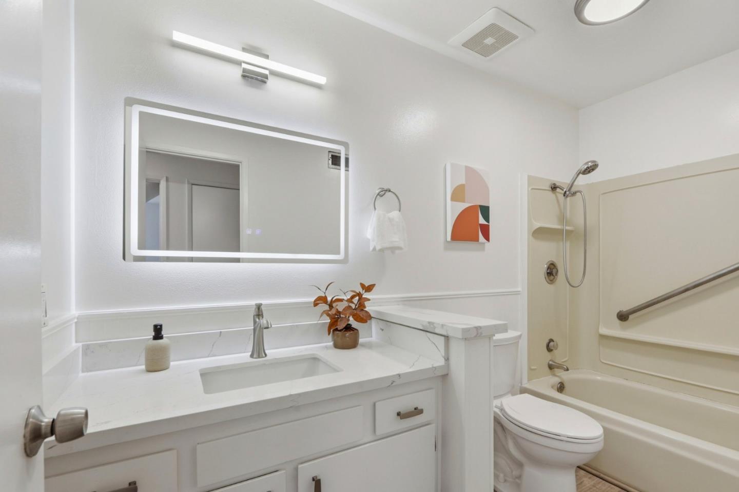 546 Woodstock Way Santa Clara, CA 95054 - Photo 18 of 24 a bathroom with a sink a toilet and a mirror