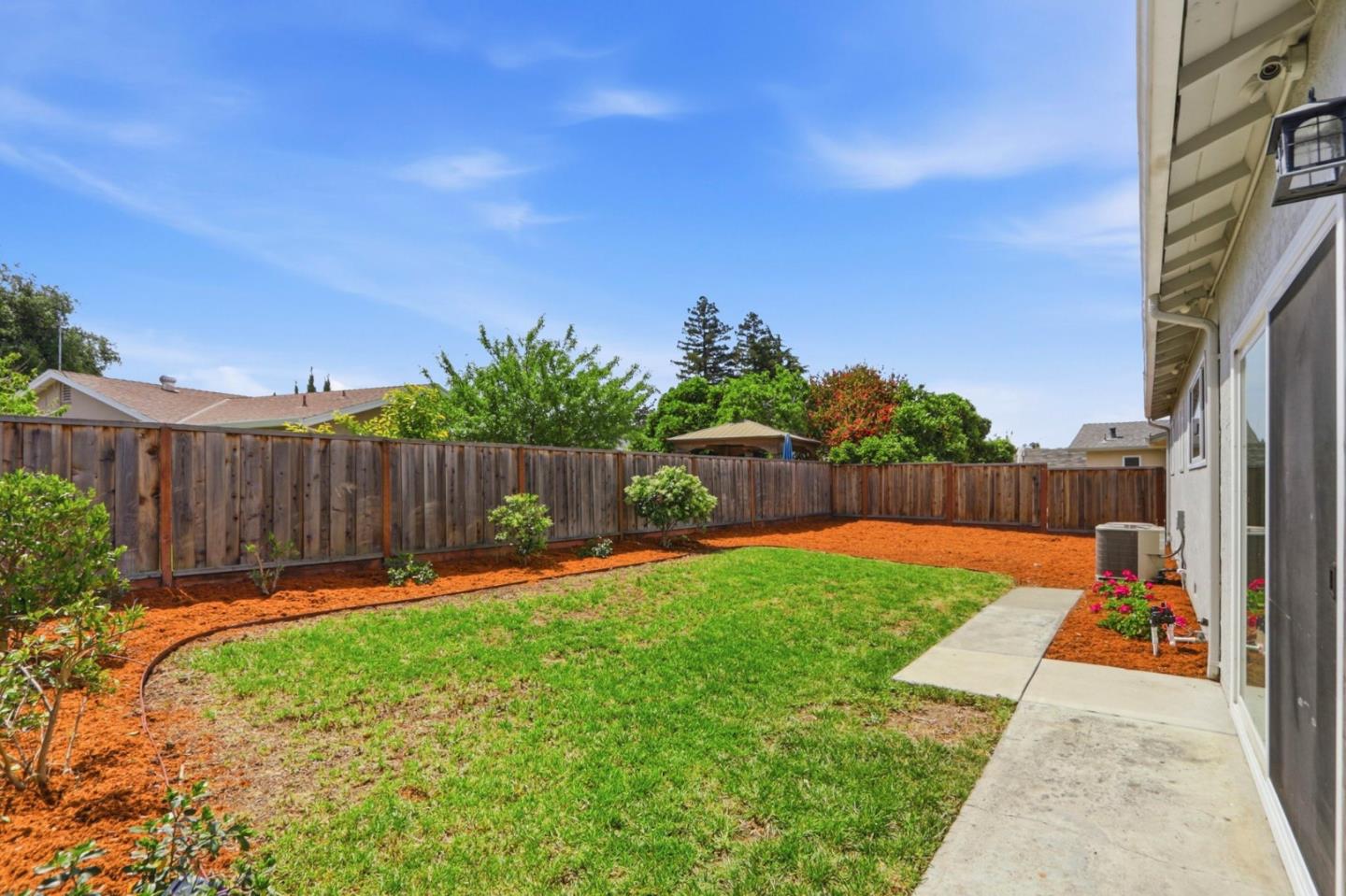 546 Woodstock Way Santa Clara, CA 95054 - Photo 19 of 24 a view of a backyard with a tree