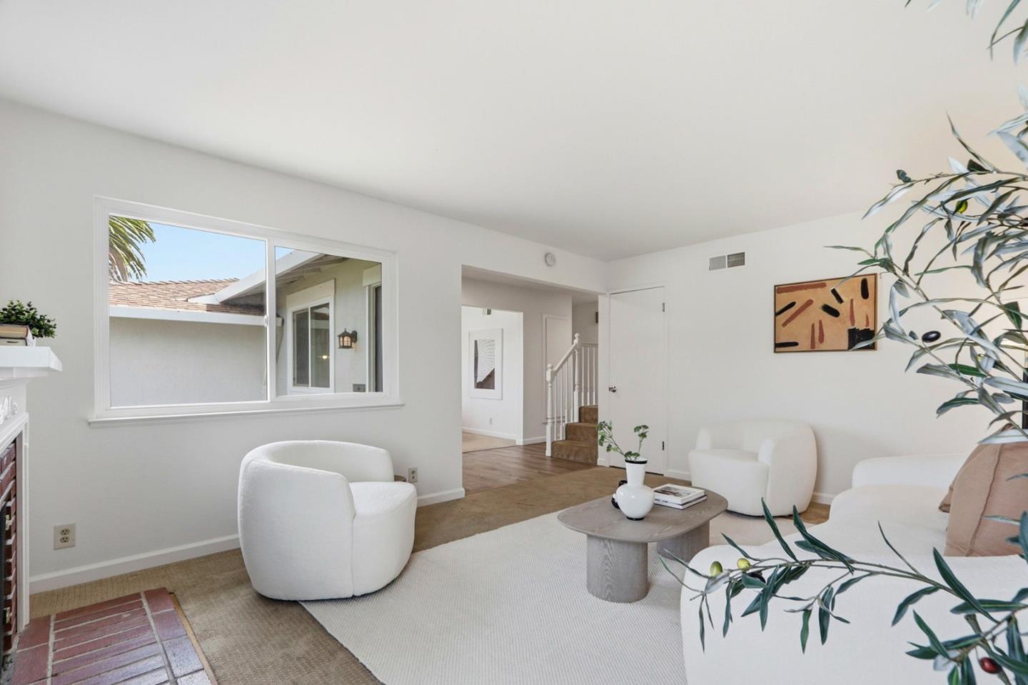 546 Woodstock Way Santa Clara, CA 95054 - Photo 3 of 24 a living room with furniture and white walls