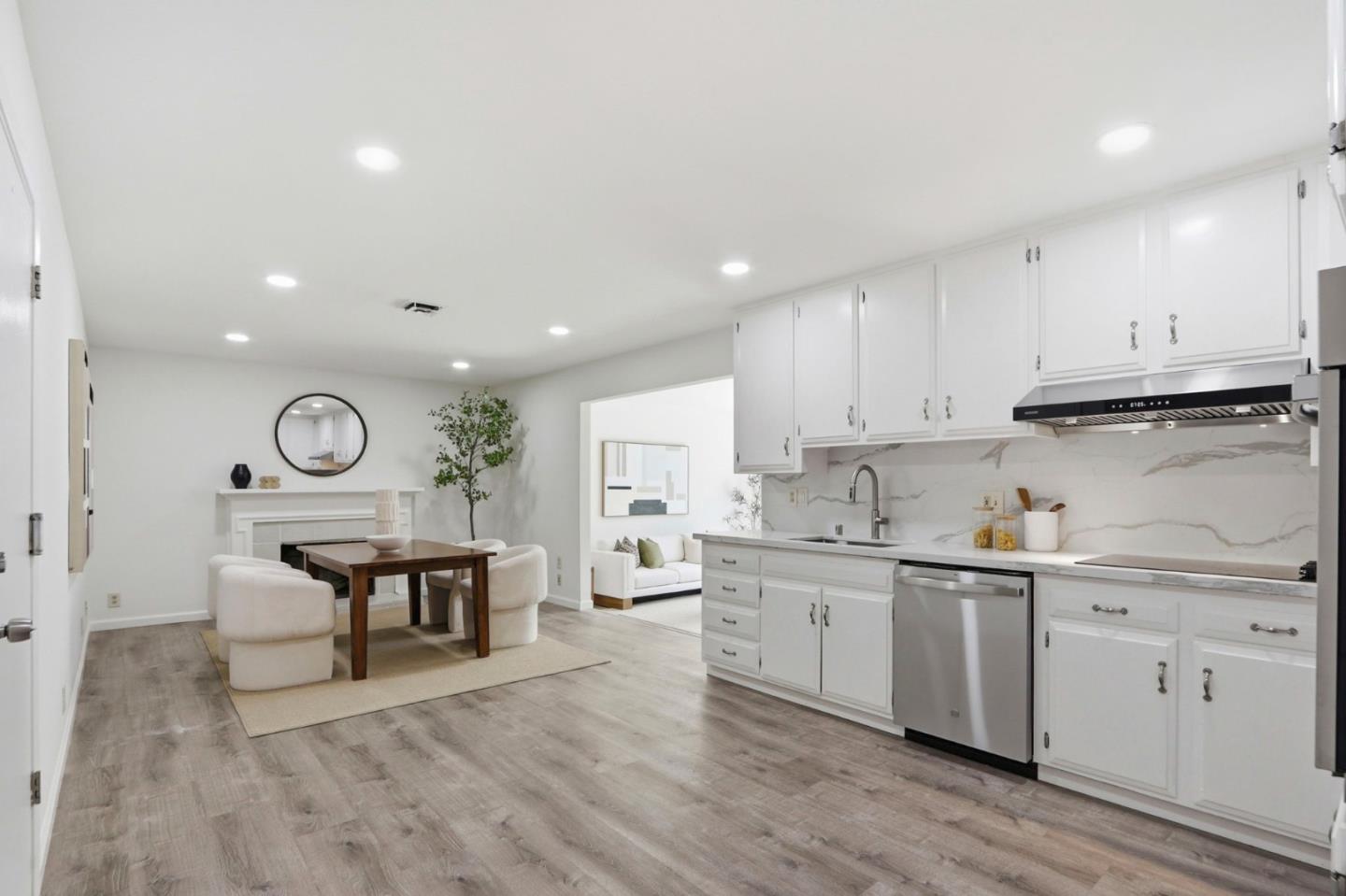 546 Woodstock Way Santa Clara, CA 95054 - Photo 8 of 24 a open kitchen with cabinets a sink and wooden floors