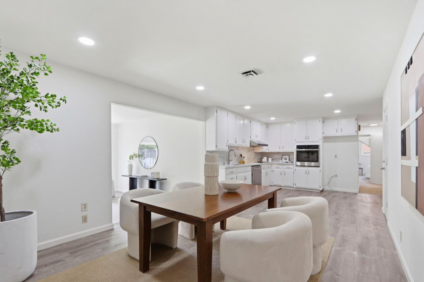 546 Woodstock Way Santa Clara, CA 95054 - Photo 9 of 24 a living room with furniture a potted plant and kitchen view