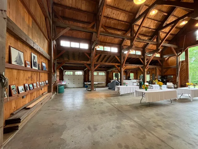 a view of a chairs and tables in patio with a tv