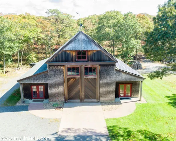 a front view of a house with yard