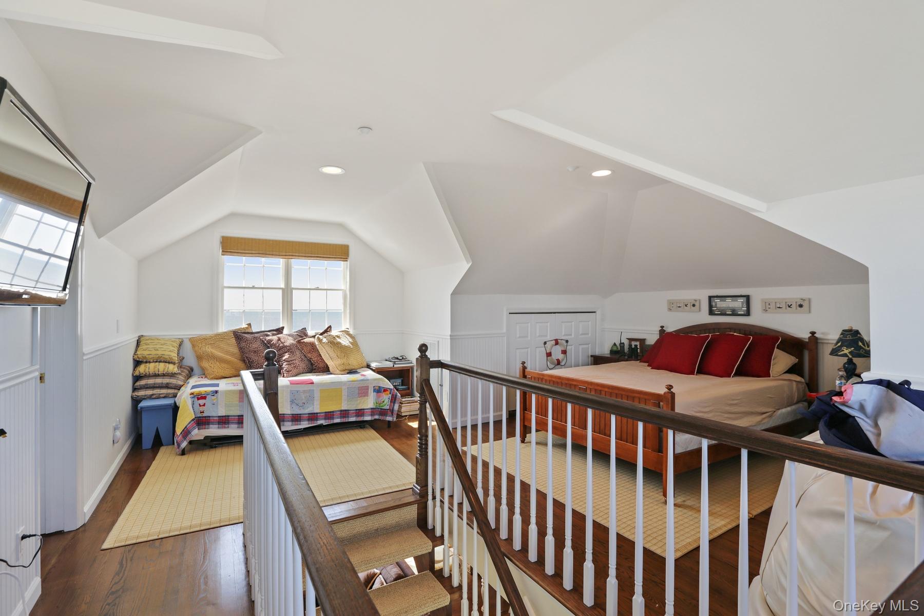 949 B Dune Road West Hampton Dunes, NY 11978 - Photo 14 of 19 Bedroom featuring vaulted ceiling and dark wood-type flooring