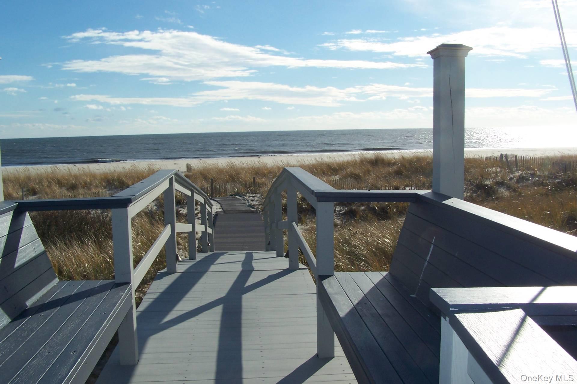 949 B Dune Road West Hampton Dunes, NY 11978 - Photo 17 of 19 Surrounding community with a water view and a beach view