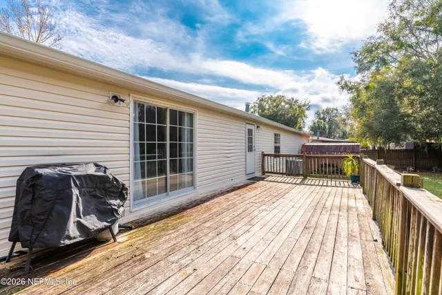 a view of a house with a yard patio and sitting area