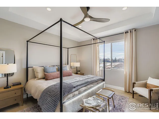 a bathroom with a granite countertop sink a toilet and a mirror