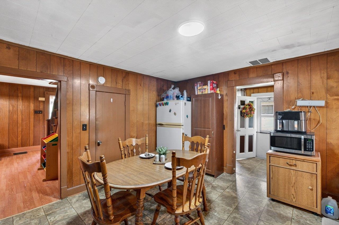 724 Newtown Road Elkton, VA 22827 - Photo 15 of 38 a view of a dining room with furniture and chandelier