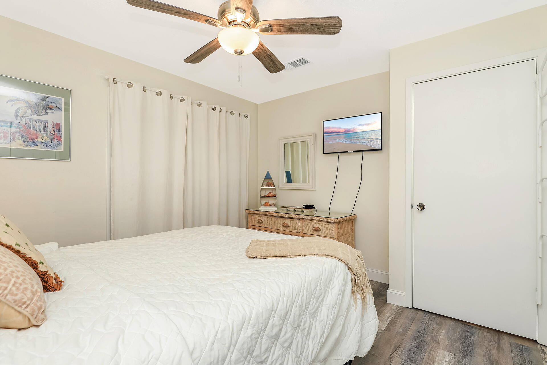 517 Augusta Way, Unit 11001 Miramar Beach, FL 32550 - Photo 11 of 27 a bedroom with a bed and a chandelier