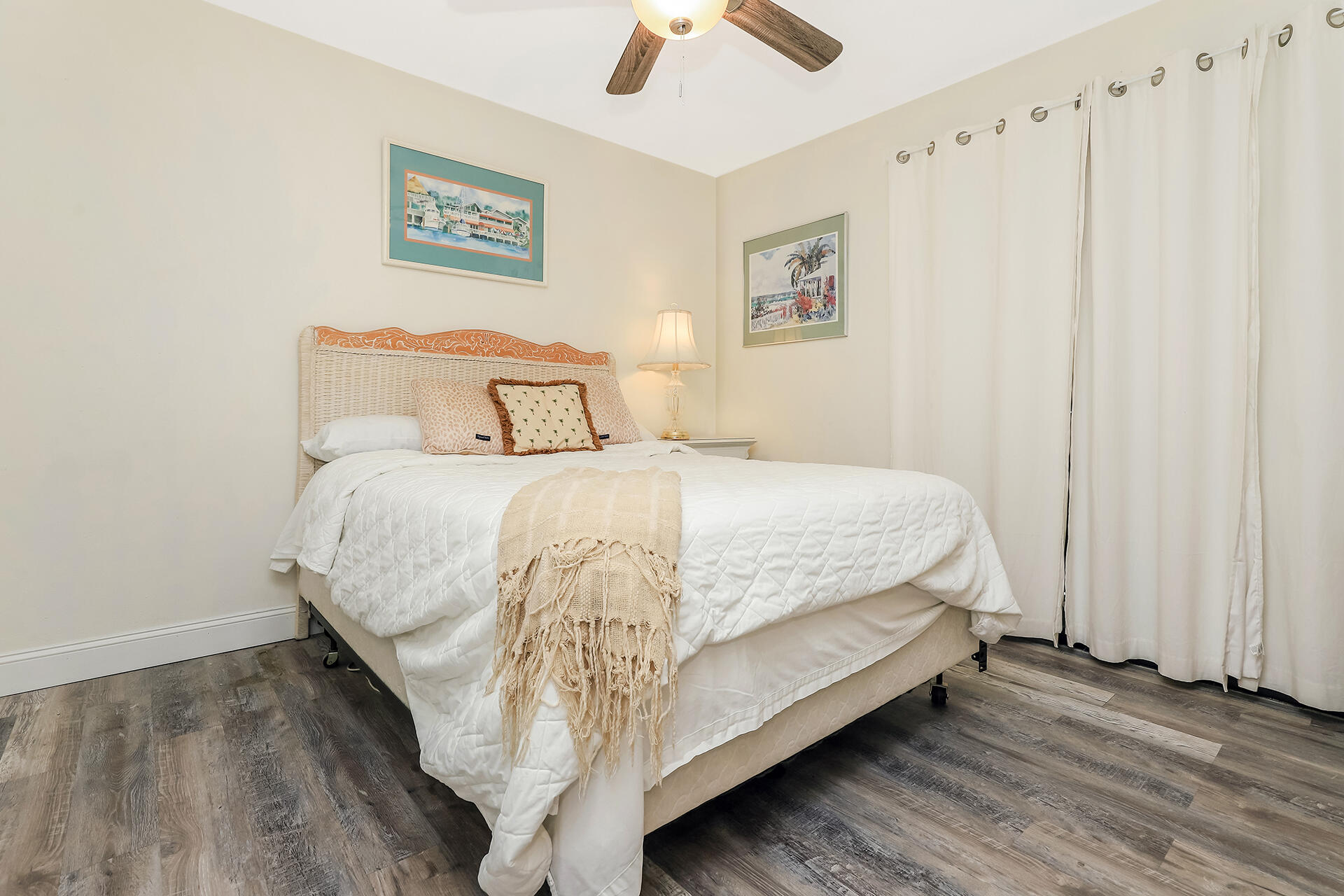 517 Augusta Way, Unit 11001 Miramar Beach, FL 32550 - Photo 12 of 27 a bedroom with a bed and a ceiling fan