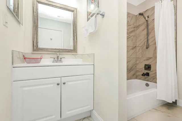 a bathroom with a bathtub and a sink