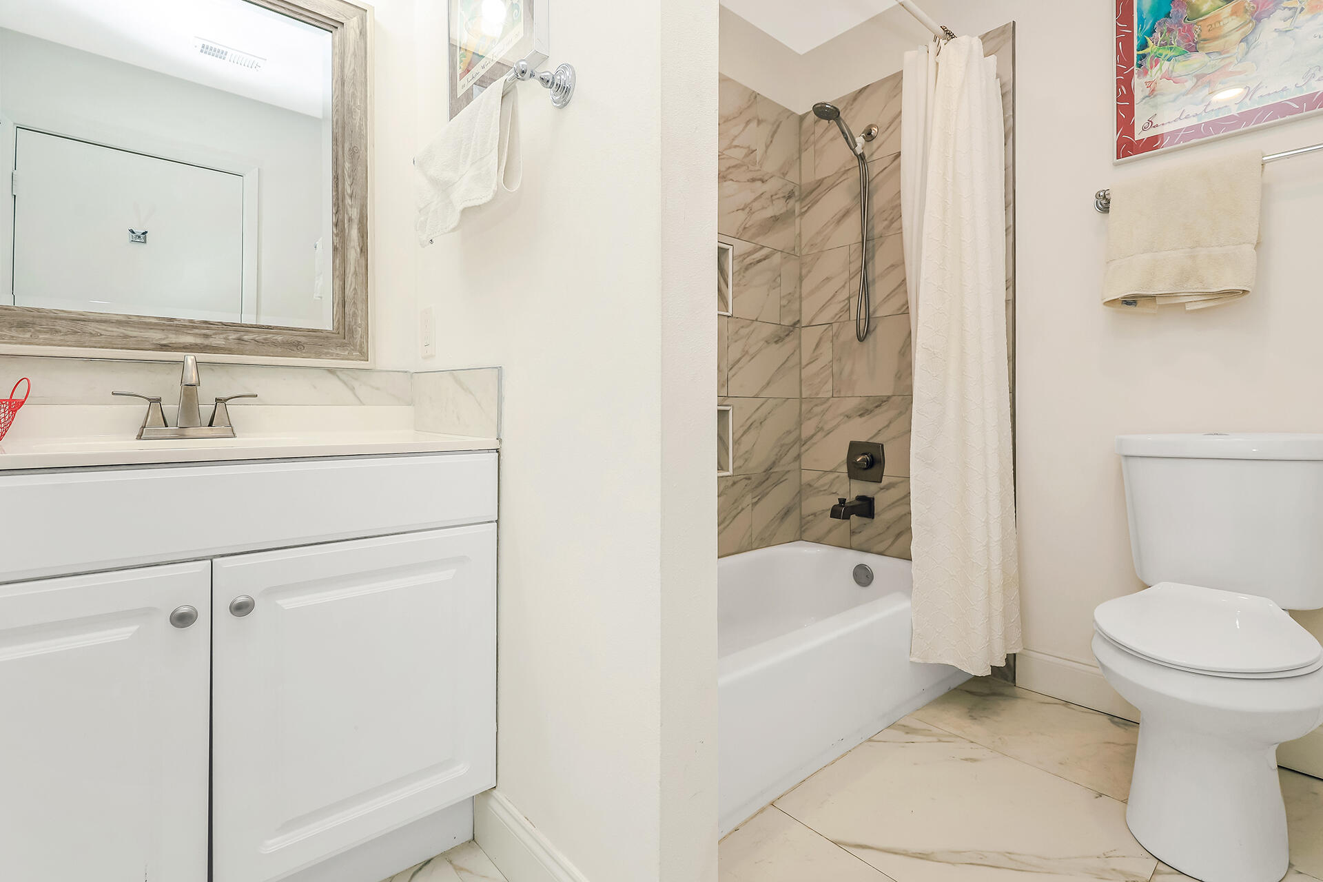 517 Augusta Way, Unit 11001 Miramar Beach, FL 32550 - Photo 14 of 27 a bathroom with a sink a toilet and shower