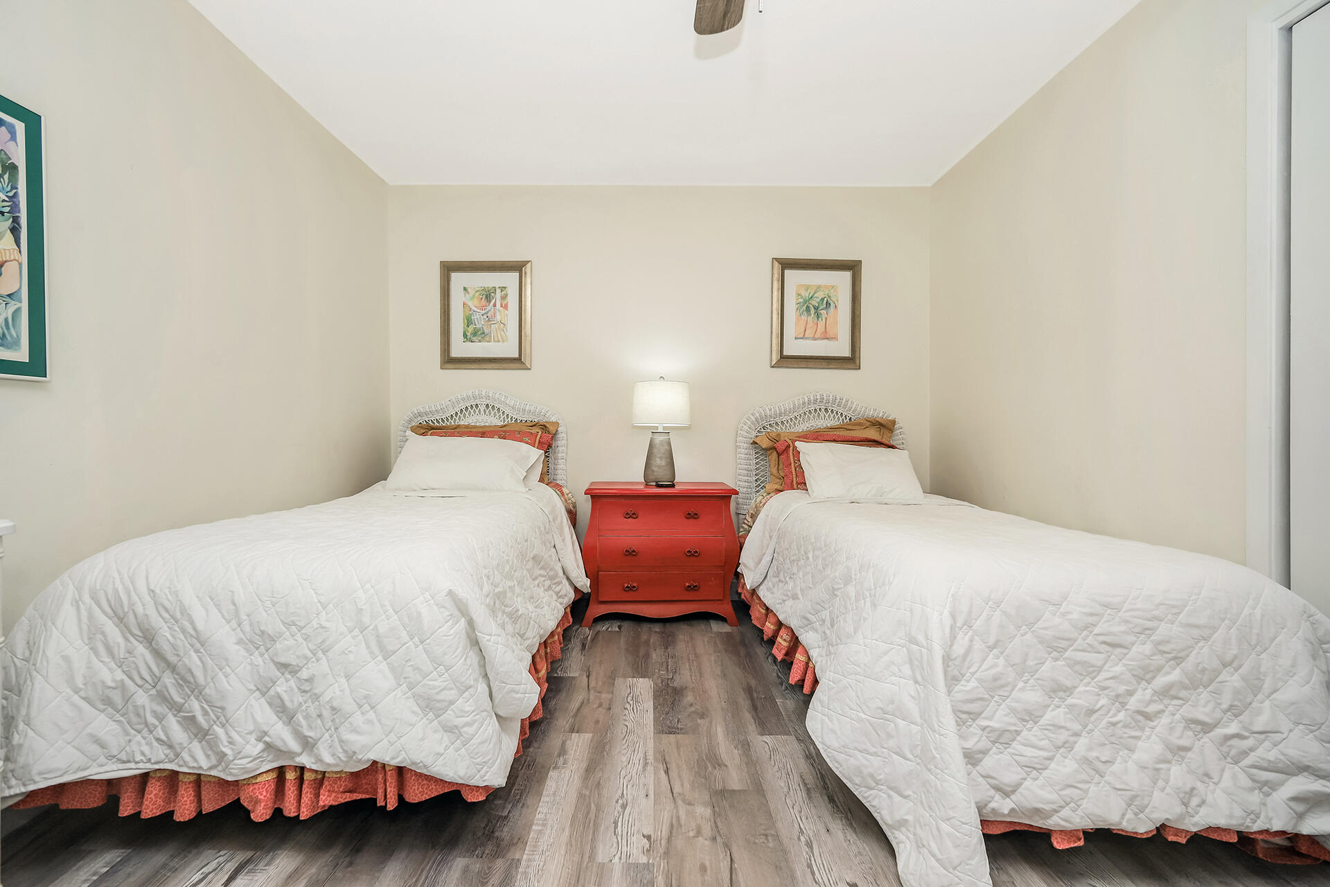 517 Augusta Way, Unit 11001 Miramar Beach, FL 32550 - Photo 16 of 27 a bedroom with a bed and wooden floor