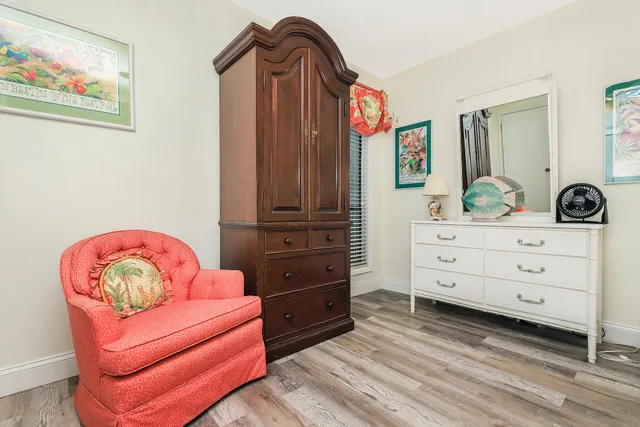 a bedroom with a bed and a dresser